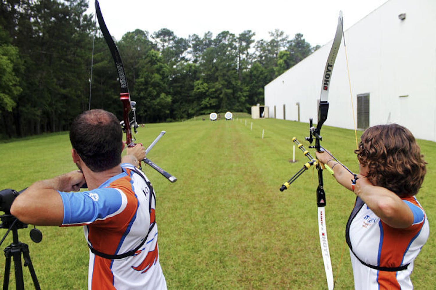 Robert Regojo and Rachel Bouchillon, a 22-year-old UF environmental science graduate student, practice on a range behind Bear Archery’s headquarters in Gainesville.&nbsp;
&nbsp;
