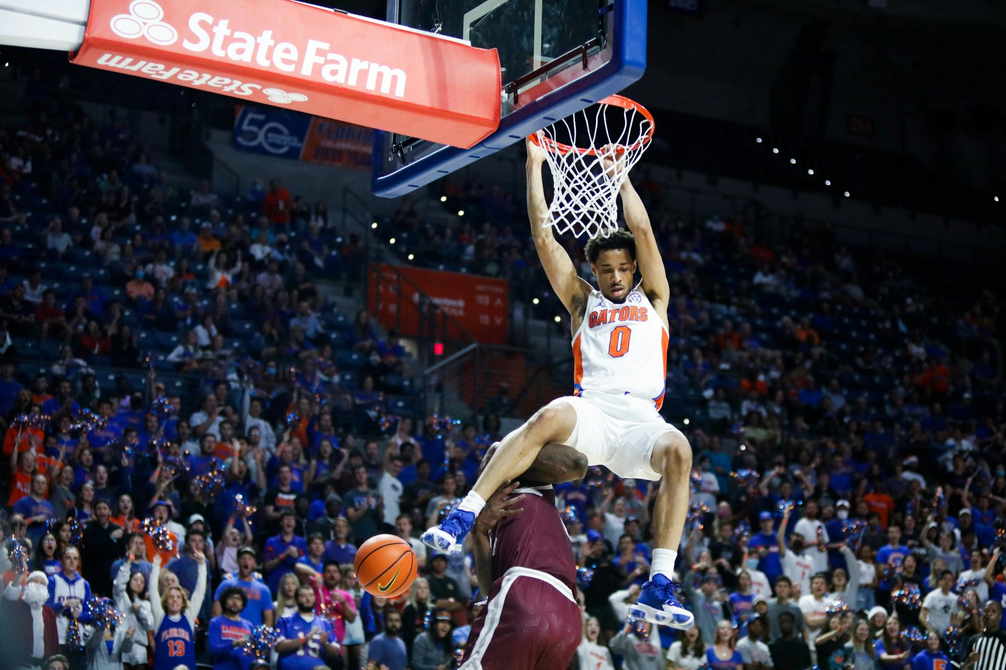 Florida&#x27;s Myreon Jones dunks during a Dec. 6 game against Texas Southern. The Penn State transfer led the game with 23 points shooting 9-11 from the field