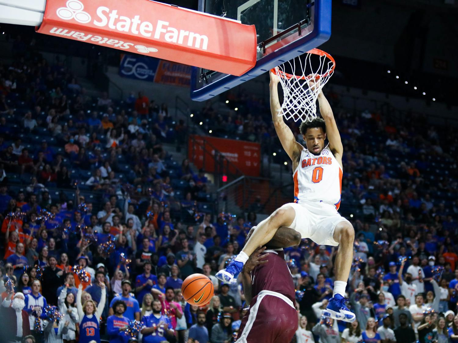 Florida&#x27;s Myreon Jones dunks during a Dec. 6 game against Texas Southern. The Penn State transfer led the game with 23 points shooting 9-11 from the field