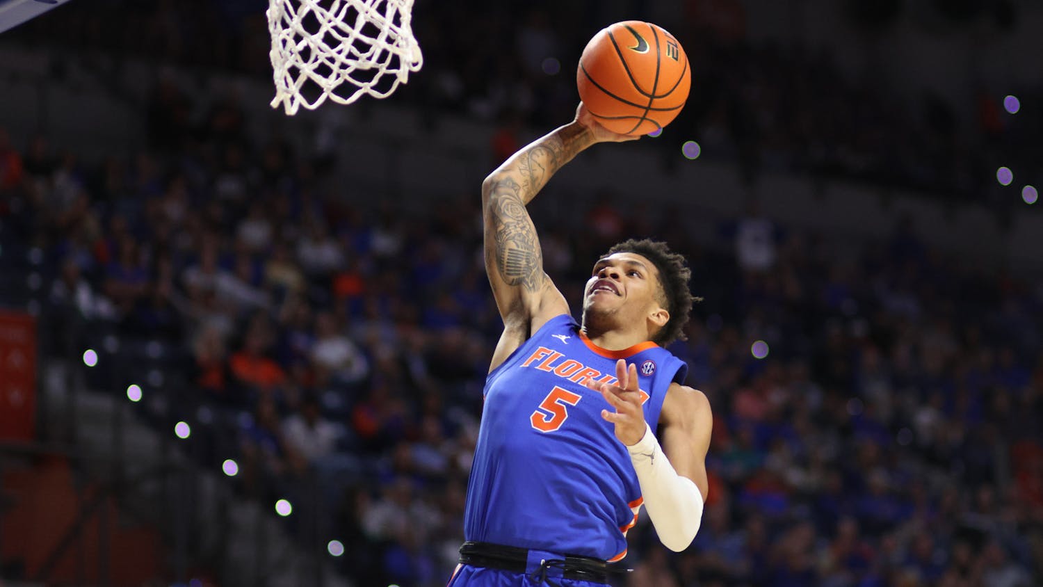 Junior guard Will Richard rises up for a dunk in the Gators' 89-68 win against the Florida State Seminoles on Friday, Nov. 17, 2023.