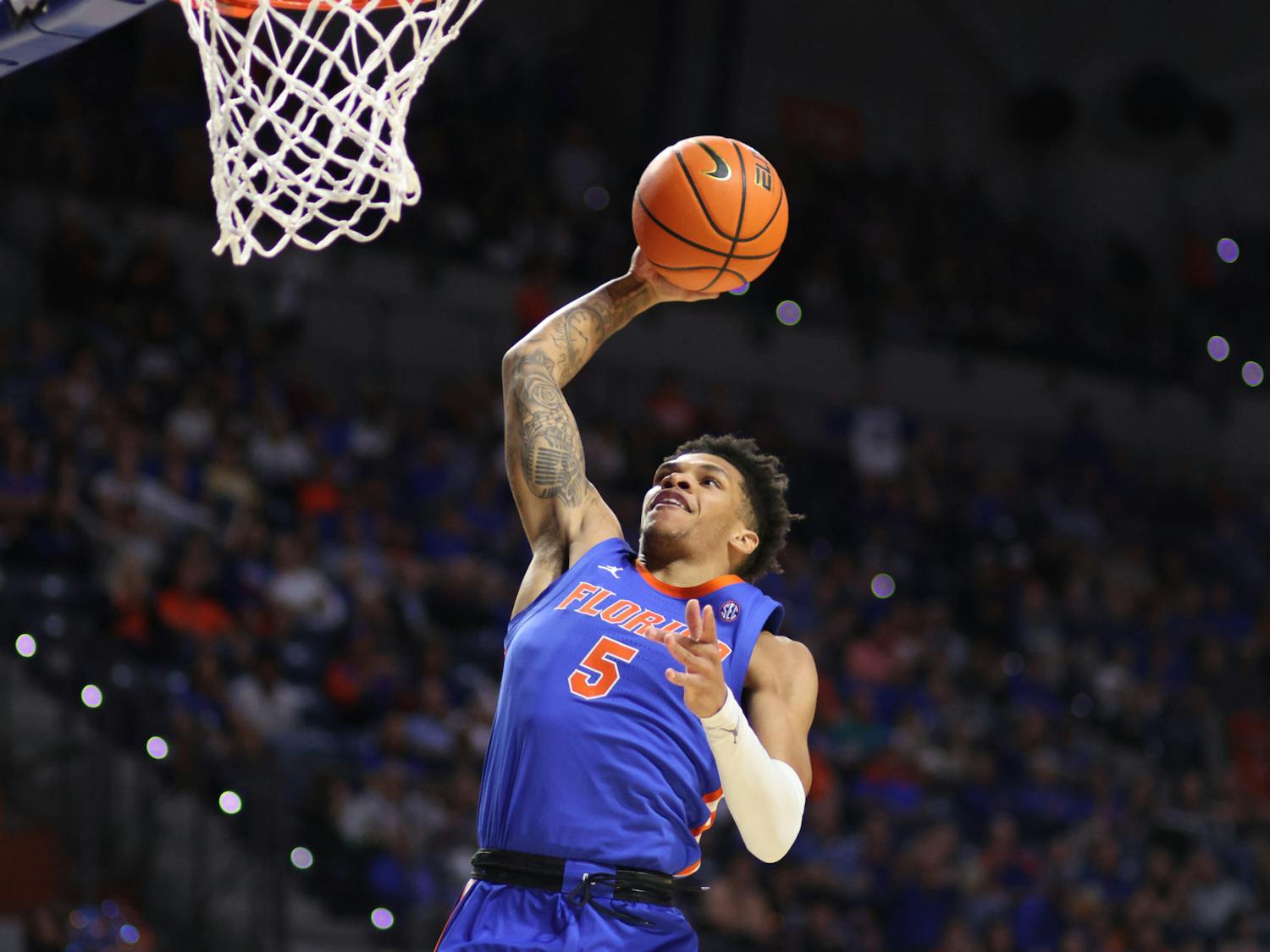 Junior guard Will Richard rises up for a dunk in the Gators' 89-68 win against the Florida State Seminoles on Friday, Nov. 17, 2023.