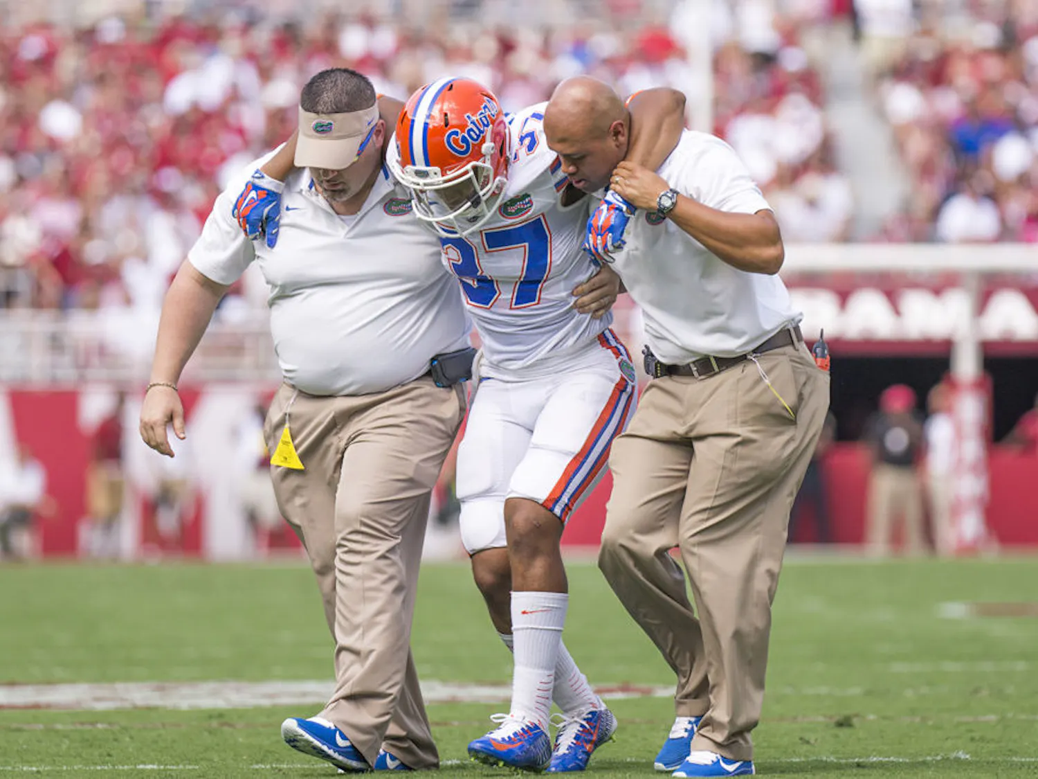 Trainers carry UF running back Mark Herndon off the field during Florida's 42-21 loss to Alabama on Saturday at Bryant-Denny Stadium.