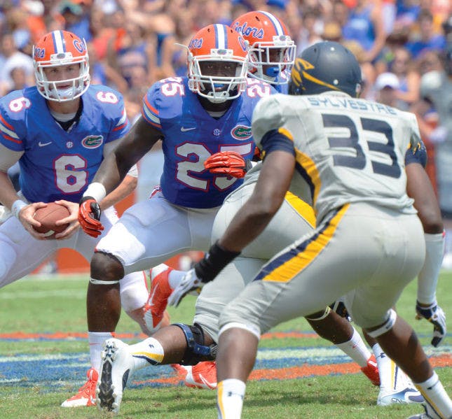 Junior fullback Gideon Ajagbe (25) blocks during Florida’s 24-6 victory against Toledo on Saturday in Ben Hill Griffin Stadium. Ajagbe caught two passes for 16 yards in the game.