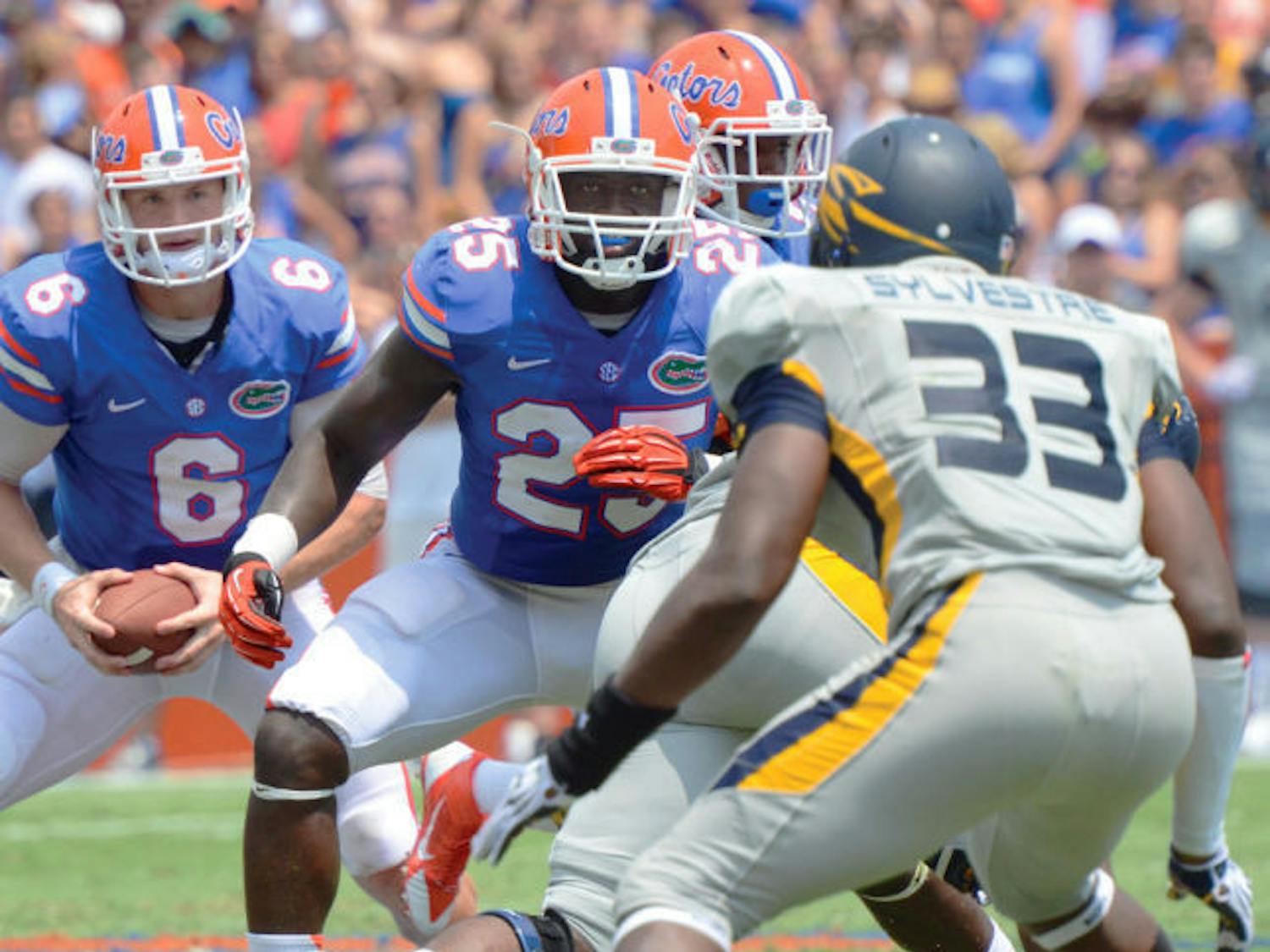 Junior fullback Gideon Ajagbe (25) blocks during Florida’s 24-6 victory against Toledo on Saturday in Ben Hill Griffin Stadium. Ajagbe caught two passes for 16 yards in the game.