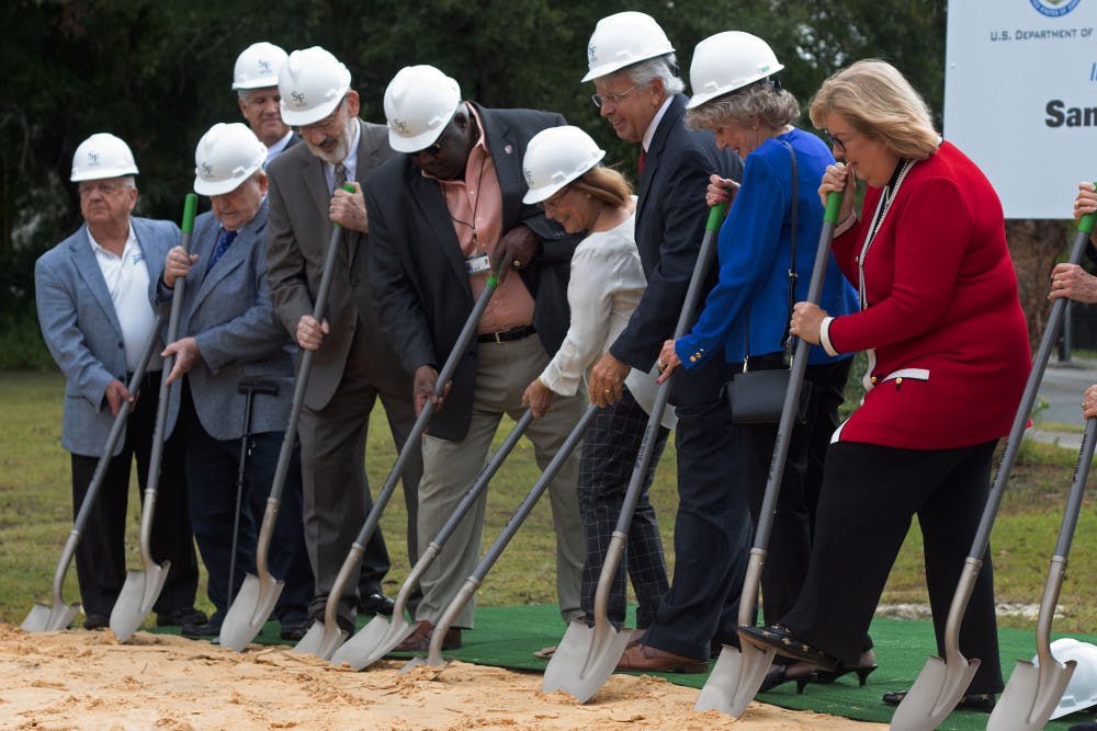 The Blount Center Board of Directors break ground at the new Blount Campus building at Santa Fe College Wednesday morning. Once completed, the building will act as a hub for “business innovation” and will include classrooms, labs and other student support and service areas.“Without this great city, this campus would have never been here,” said Santa Fe College president Dr. Jackson N. Sasser during the ceremony.