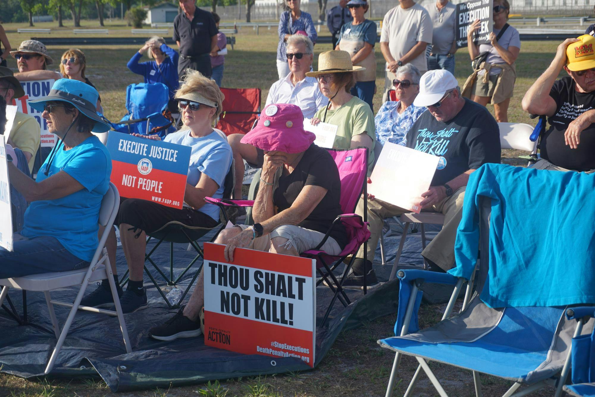 Protestors gather outside the Florida State Prison before an execution, Tuesday, April 21, 2026, in Raiford, Fla.