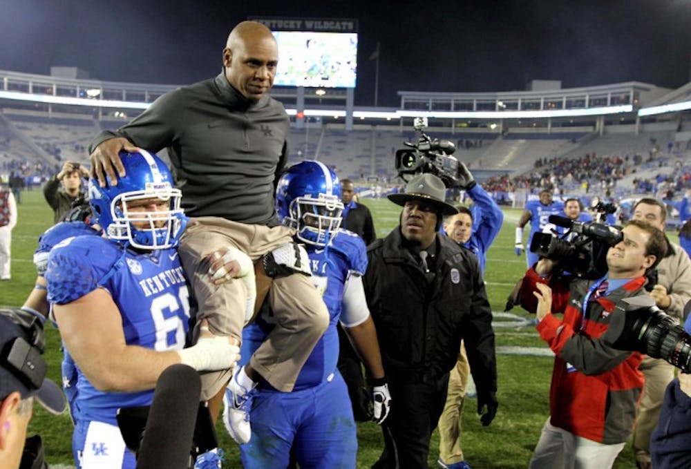 <p><span>Fired Kentucky coach Joker Phillips, top, is carried off the field after UK’s 34-3 win against Samford on Nov. 17 in Lexington, Ky. Phillips was hired on Monday to coach Florida’s wide receivers.&nbsp;</span></p>
<div><span><br /></span></div>