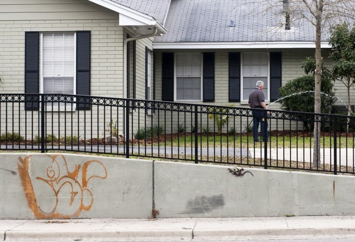 Graffiti covers the wall in front of a house on University Avenue on Thursday. In response to increased amounts of graffiti, spokesman Bob Woods said the city has developed a campaign to raise public awareness toward the issue and minimize the unwelcome marks. The campaign will be unrolled this month.