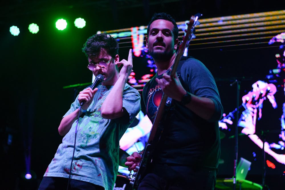 <p>Robbie Kingsley, the band’s lead singer, and Andre Escobar, the bassist, perform during the 2019 Heartwood Music Festival on Feb. 23.</p>