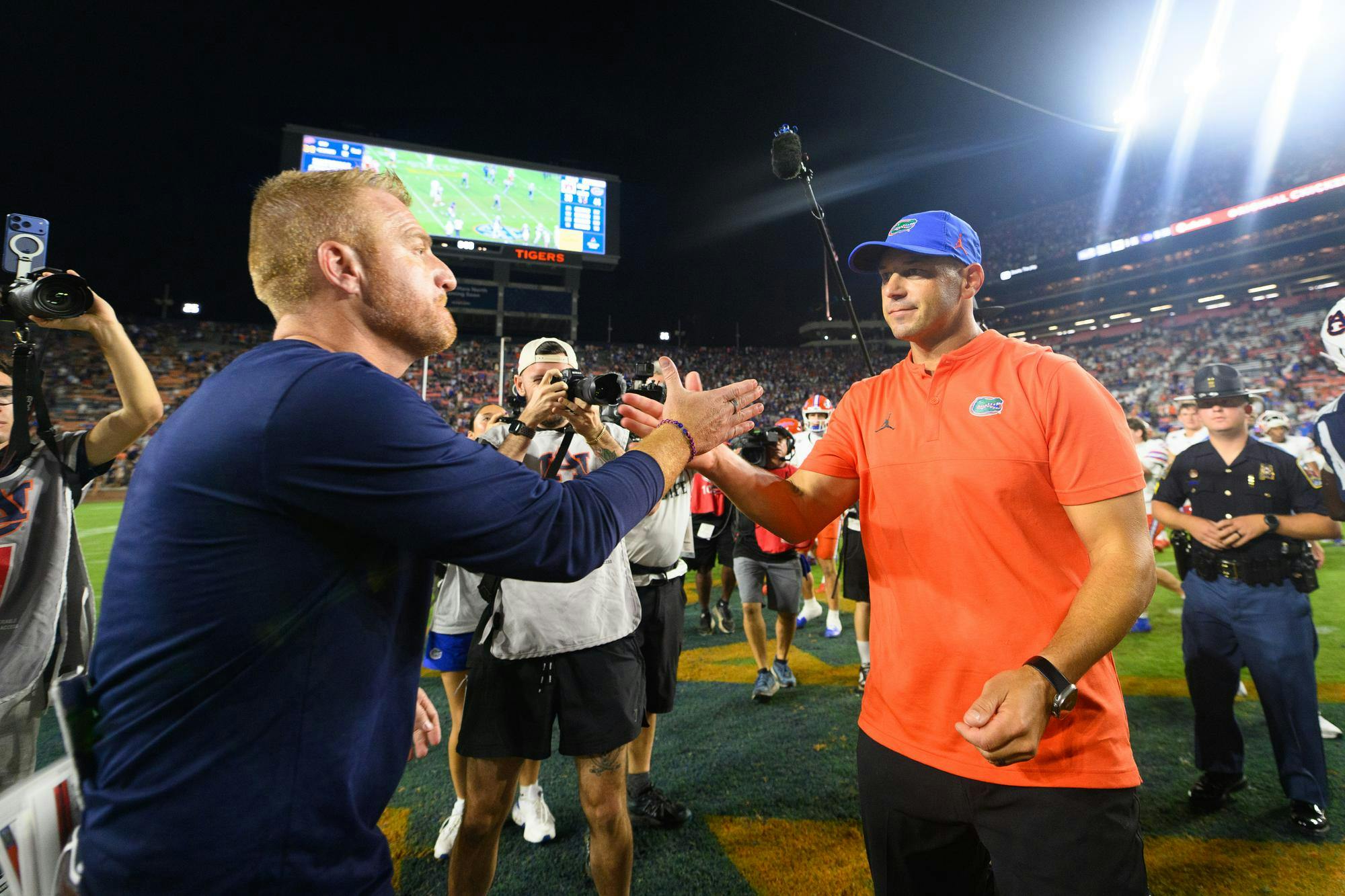 Florida head coach Jon Sumrall shakes hands with Auburn head coach Alex Golesh after winning an NCAA college football game, Saturday, Sept. 19, 2026, in Auburn, Ala.