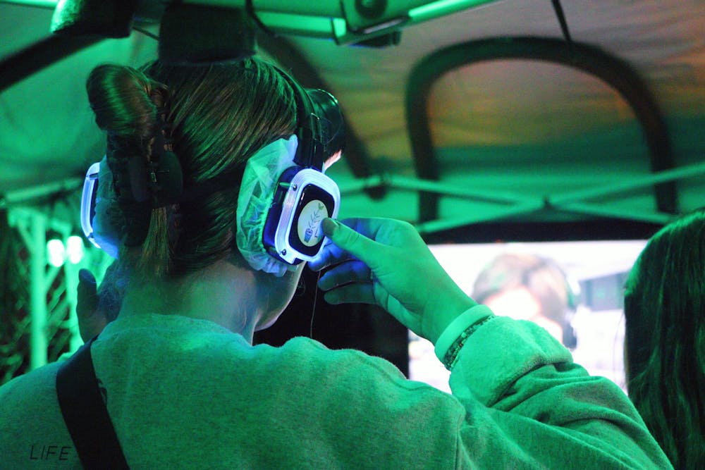 <p>A fear garden attendee prepares to enter the tent of terror, Gainesville’s latest spooky attraction the Fear Garden. Participants are asked to wear headphones and blackout goggles Friday, Oct. 14, 2022. </p>