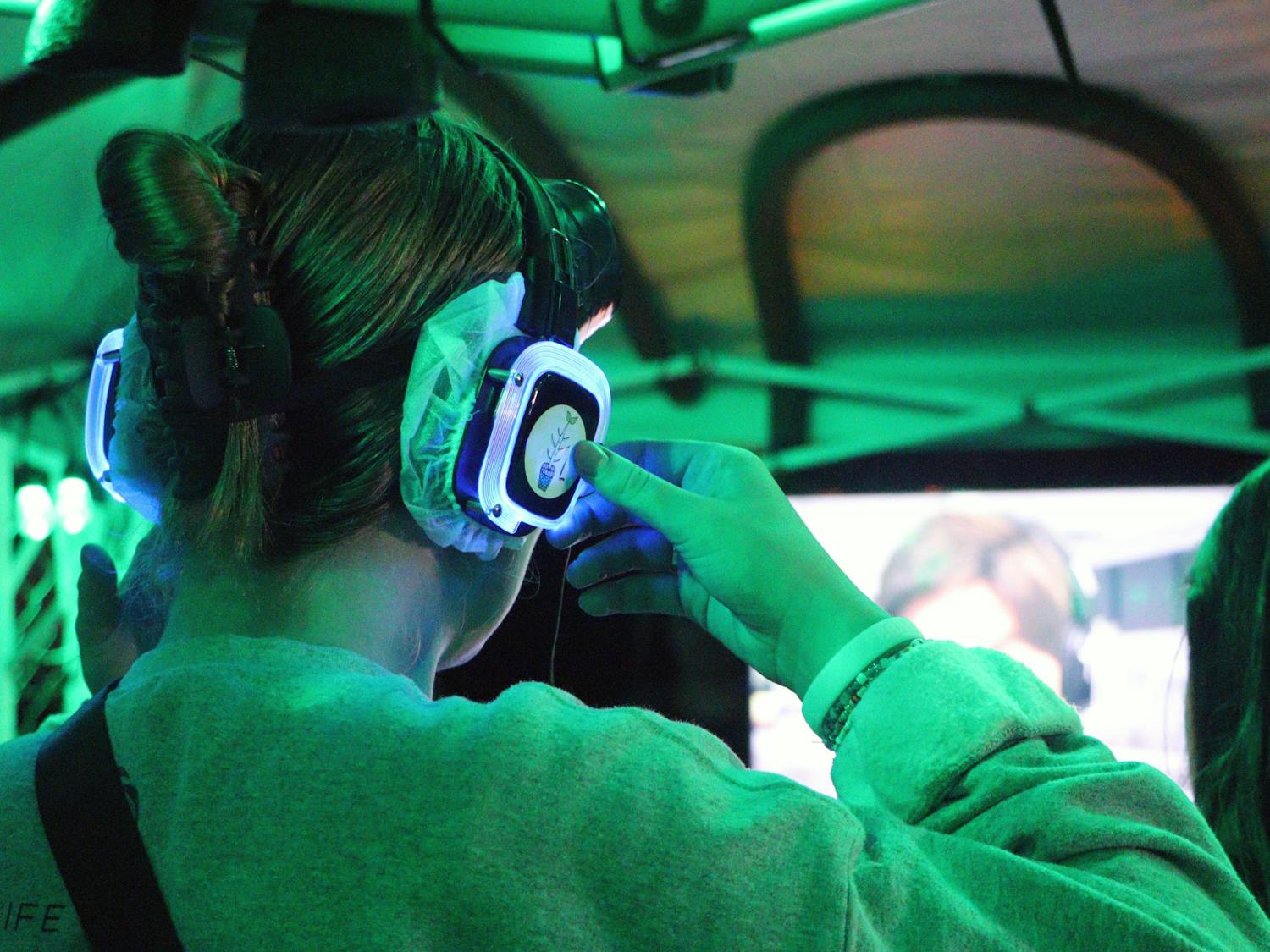 A fear garden attendee prepares to enter the tent of terror, Gainesville’s latest spooky attraction the Fear Garden. Participants are asked to wear headphones and blackout goggles Friday, Oct. 14, 2022.
