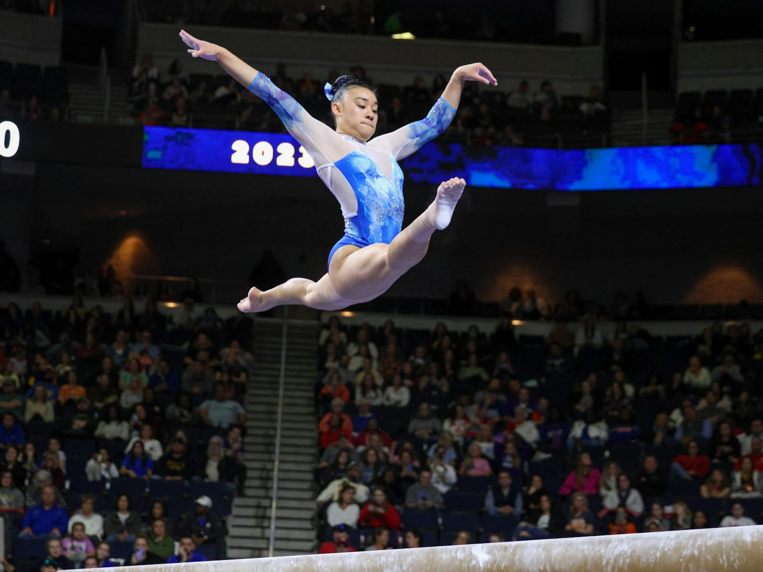 Florida sophomore Leanne Wong jumps in the air during her balance beam routine in the Southeastern Conference Championship Saturday, March 18, 2023.