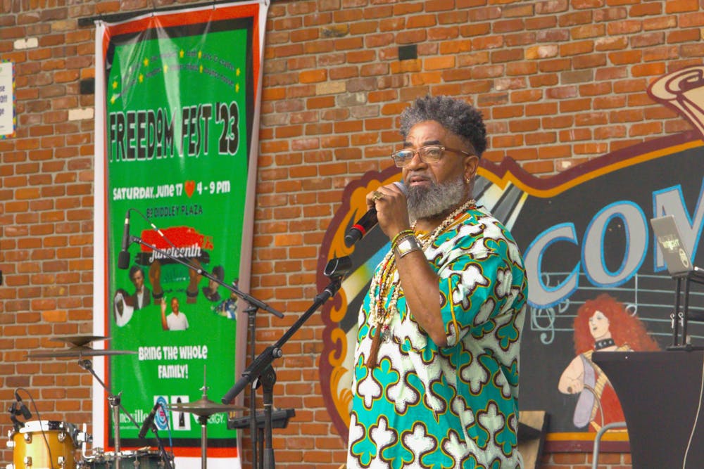 <p>Turbado Marabou, a Yoruba Priest, gives a speech about ancestry at the Bo Diddley Plaza on Saturday, June 17, 2023. Marabou performed a libation, a spiritual ceremony where he poured liquid into a bowl.  <br/><br/></p>
