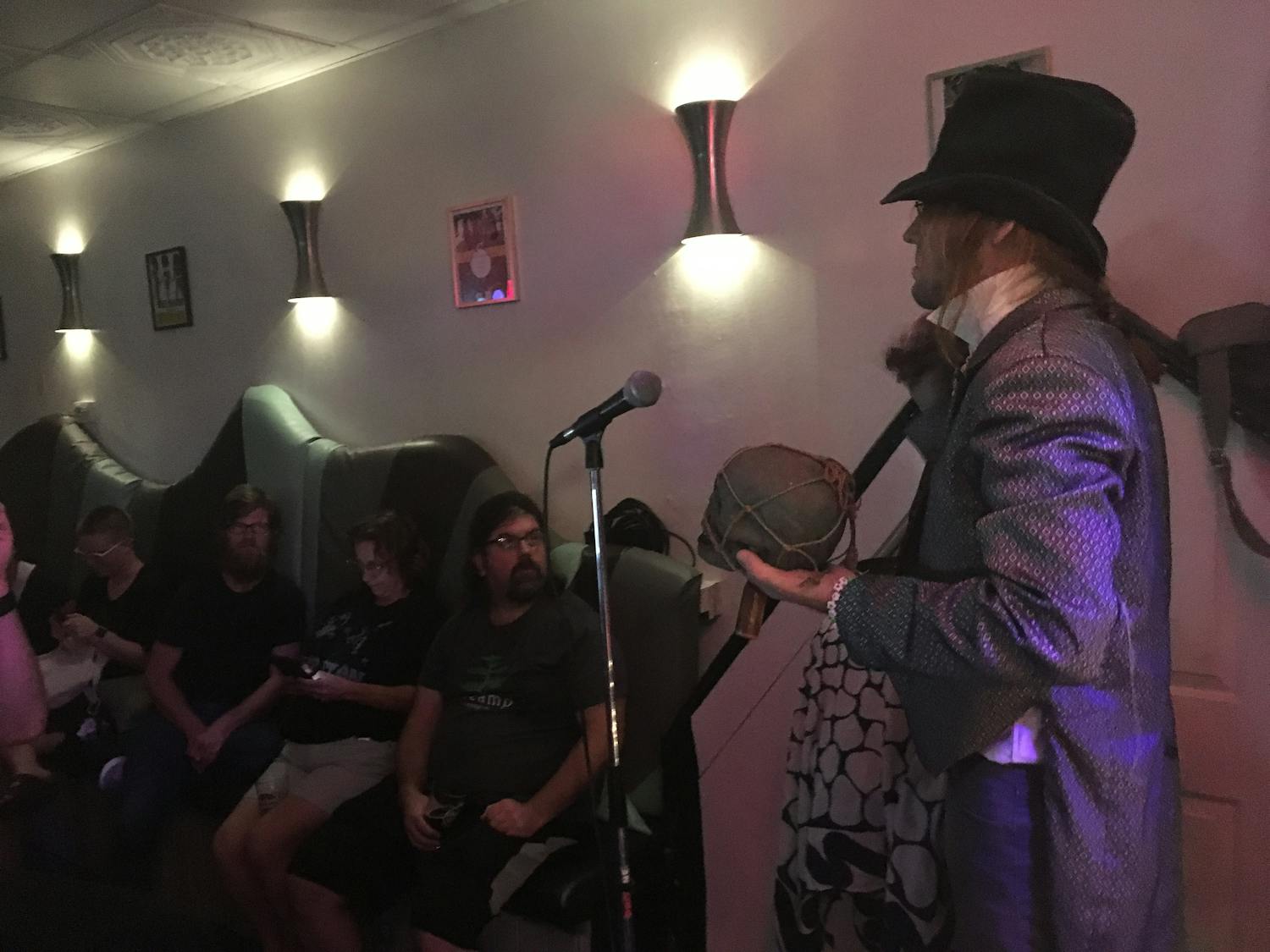 George “Fodder” O’Brien performs a mock exorcism of Richard Spencer to about 25 residents on Monday night at Maude’s Side Car Bar, located at 101 SE Second Place. The exorcism event was hosted by the absurdist mock church the Tabernacle of Hedonism to satirize Spencer’s appearance at UF on Thursday, church host Tom Miller said.