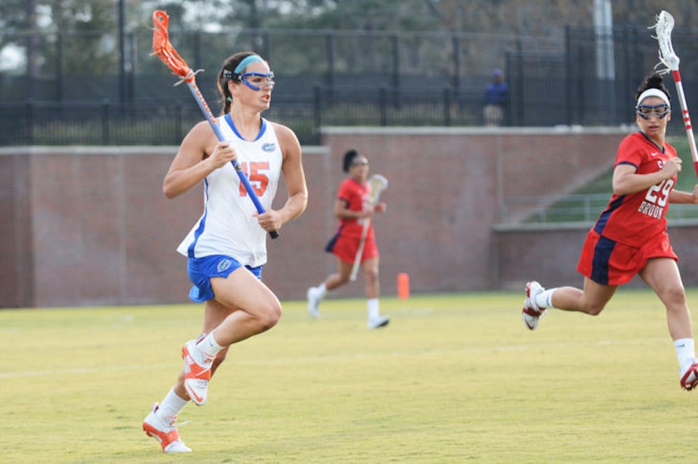 <p class="p1"><span class="s1">Senior Sam Farrell runs down the field during Florida’s 16-9 win against Stony Brook on Feb. 20 at Dizney Stadium. UF will clinch the American Lacrosse Conference championship outright win a win against Northwestern on Saturday and a Penn State loss.</span></p>