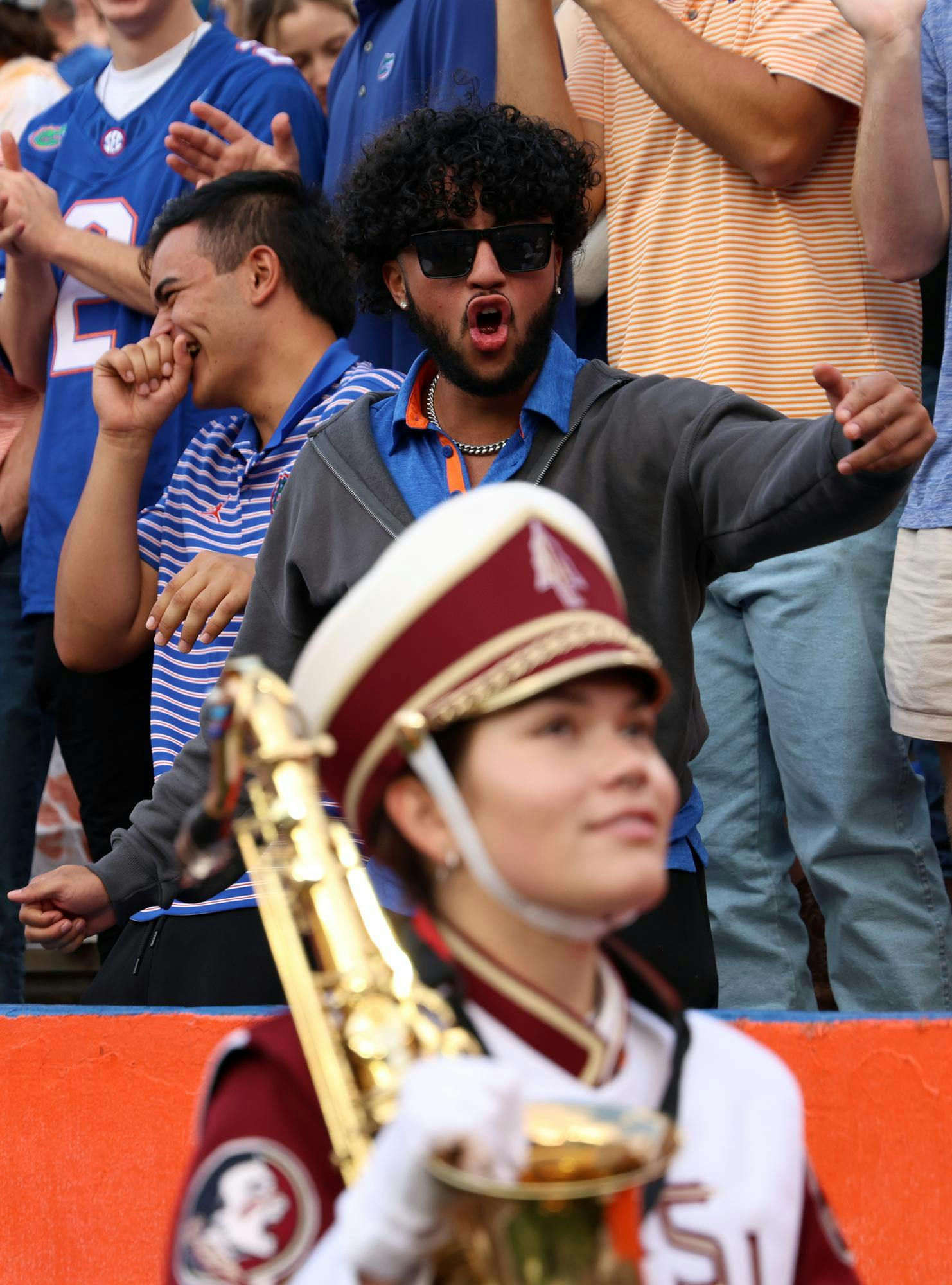 UF fans heckle a member of the FSU Marching Chiefs at the Ben Hill Griffin Stadium just before the Gator's rivalry game against the Seminoles on Saturday, Nov. 29, 2025.