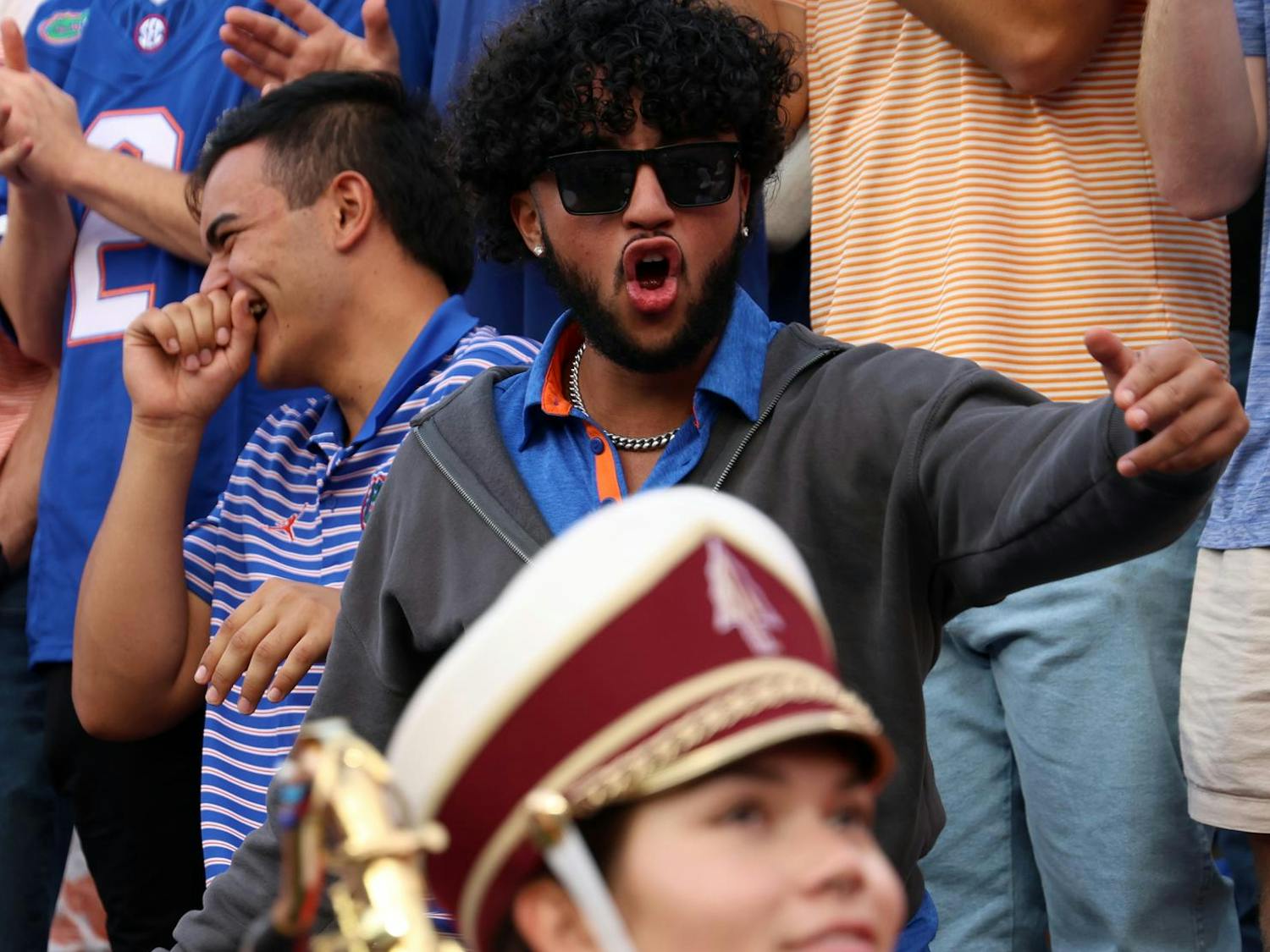 UF fans heckle a member of the FSU Marching Chiefs at the Ben Hill Griffin Stadium just before the Gator's rivalry game against the Seminoles on Saturday, Nov. 29, 2025.