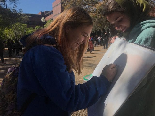 Kaitlin Thorp, an 18-year-old UF wildlife ecology and conservation freshman, stopped by Turlington Plaza on Wednesday morning to participate in Pin Syria on a Map, an event put on by Students Organize for Syria.
&nbsp;