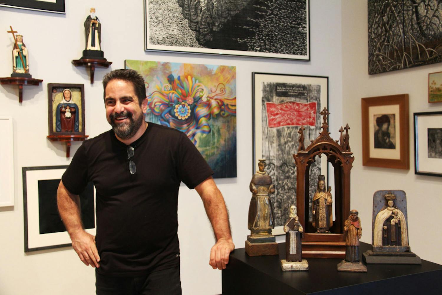 Hector Puig stands with some of the pieces of his collection in the University Gallery.