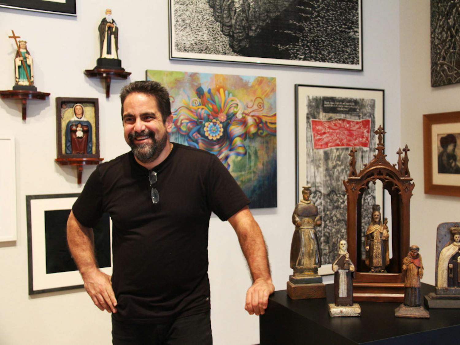 Hector Puig stands with some of the pieces of his collection in the University Gallery.