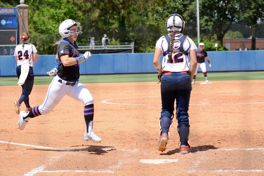 <p>UF's Kirsti Merritt crosses home plate to score the lone run of the game in the eighth inning of Florida softball's 1-0 win against Florida Atlantic during the NCAA Regional finals on May 17, 2015, at Katie Seashole Pressly Stadium.</p>
