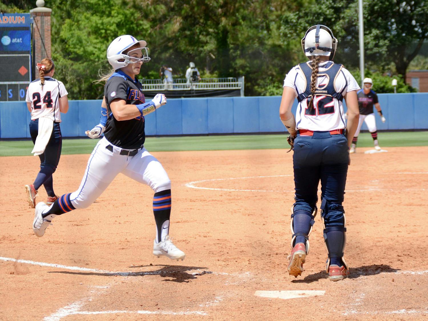 UF's Kirsti Merritt crosses home plate to score the lone run of the game in the eighth inning of Florida softball's 1-0 win against Florida Atlantic during the NCAA Regional finals on May 17, 2015, at Katie Seashole Pressly Stadium.