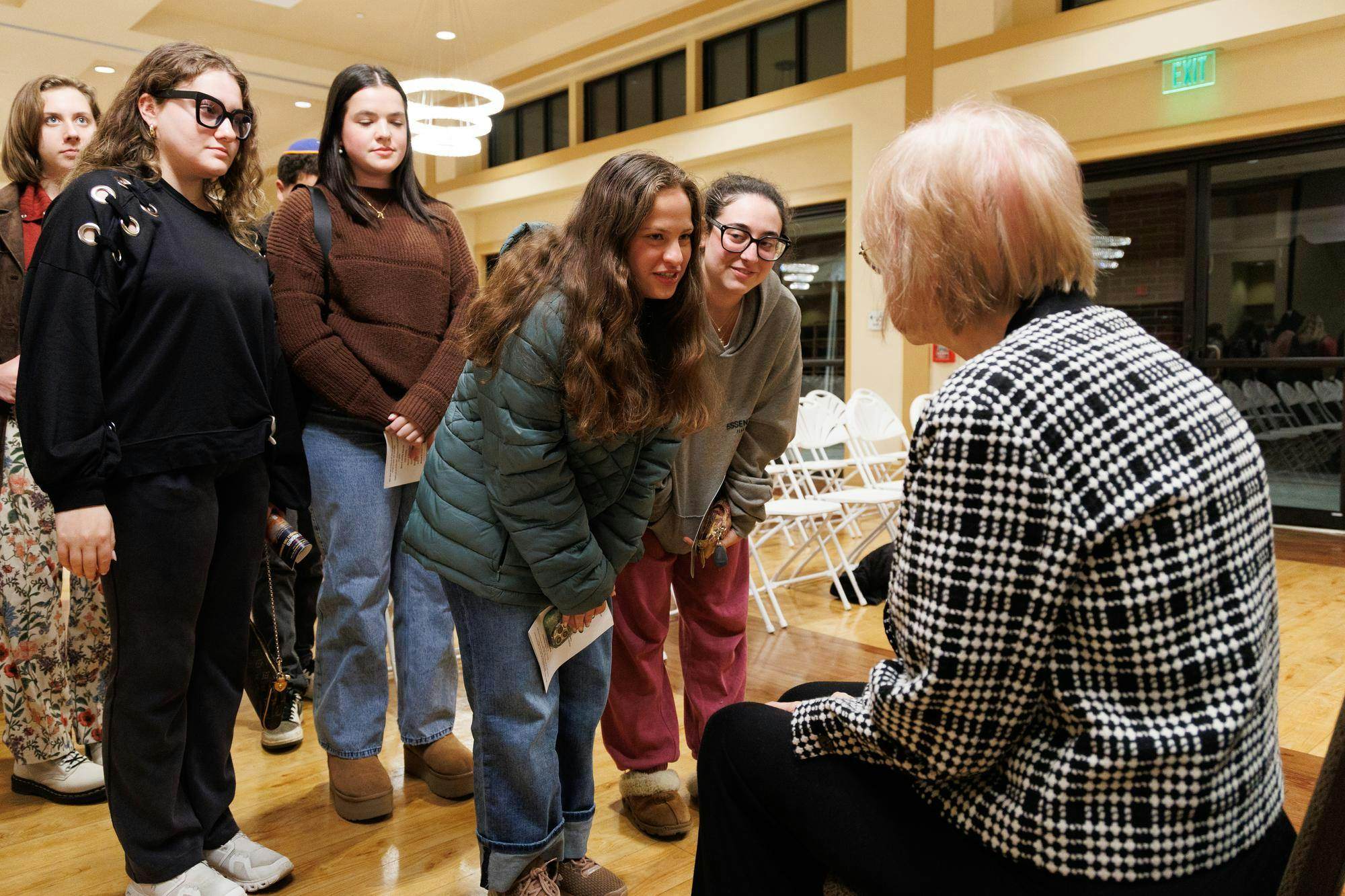 Ariella Hershfield speaks with Auschwitz survivor Sora Vigorito at an International Holocaust Remembrance Day event at the Chabad UF Jewish Center in Gainesville, Fla., Wednesday, Jan. 21, 2026.