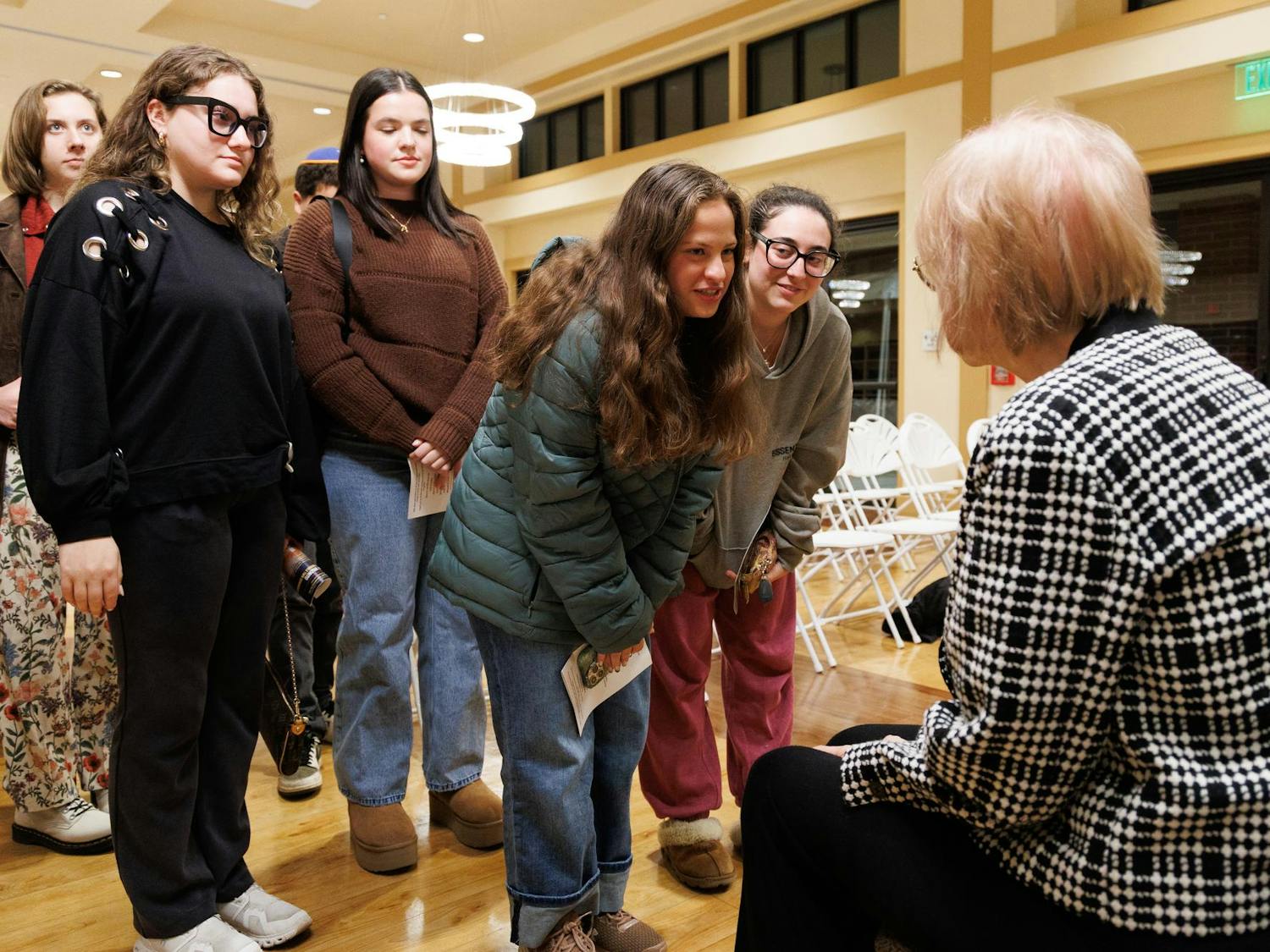 Ariella Hershfield speaks with Auschwitz survivor Sora Vigorito at an International Holocaust Remembrance Day event at the Chabad UF Jewish Center in Gainesville, Fla., Wednesday, Jan. 21, 2026.