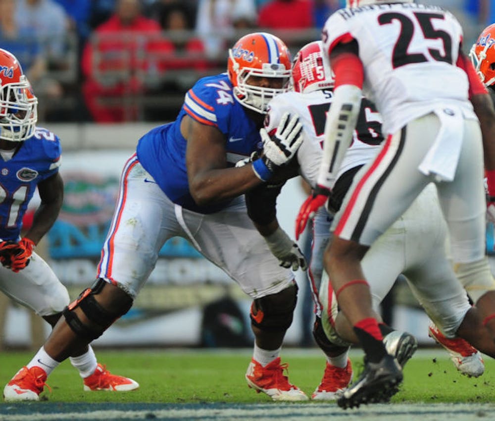 <p>Florida right tackle Trenton Brown (74) blocks Georgia defensive lineman Garrison Smith (56) during the Gators’ 23-20 loss to the Bulldogs on Saturday at EverBank Field in Jacksonville.</p>