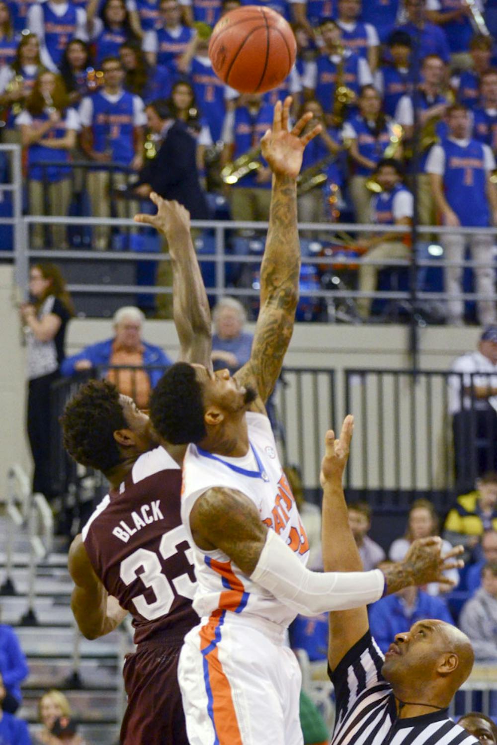 <p>Chris Walker jumps for the opening tipoff during Florida's 72-47 win against Mississippi State on Jan. 10, 2015, in the O'Connell Center.</p>