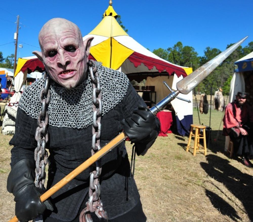 <p>David Buth, 46, an Alachua County resident, dresses as Azog, a 446-year-old Orc from Moria, for the 26th annual Hoggetowne Medieval Faire on Saturday afternoon.</p>