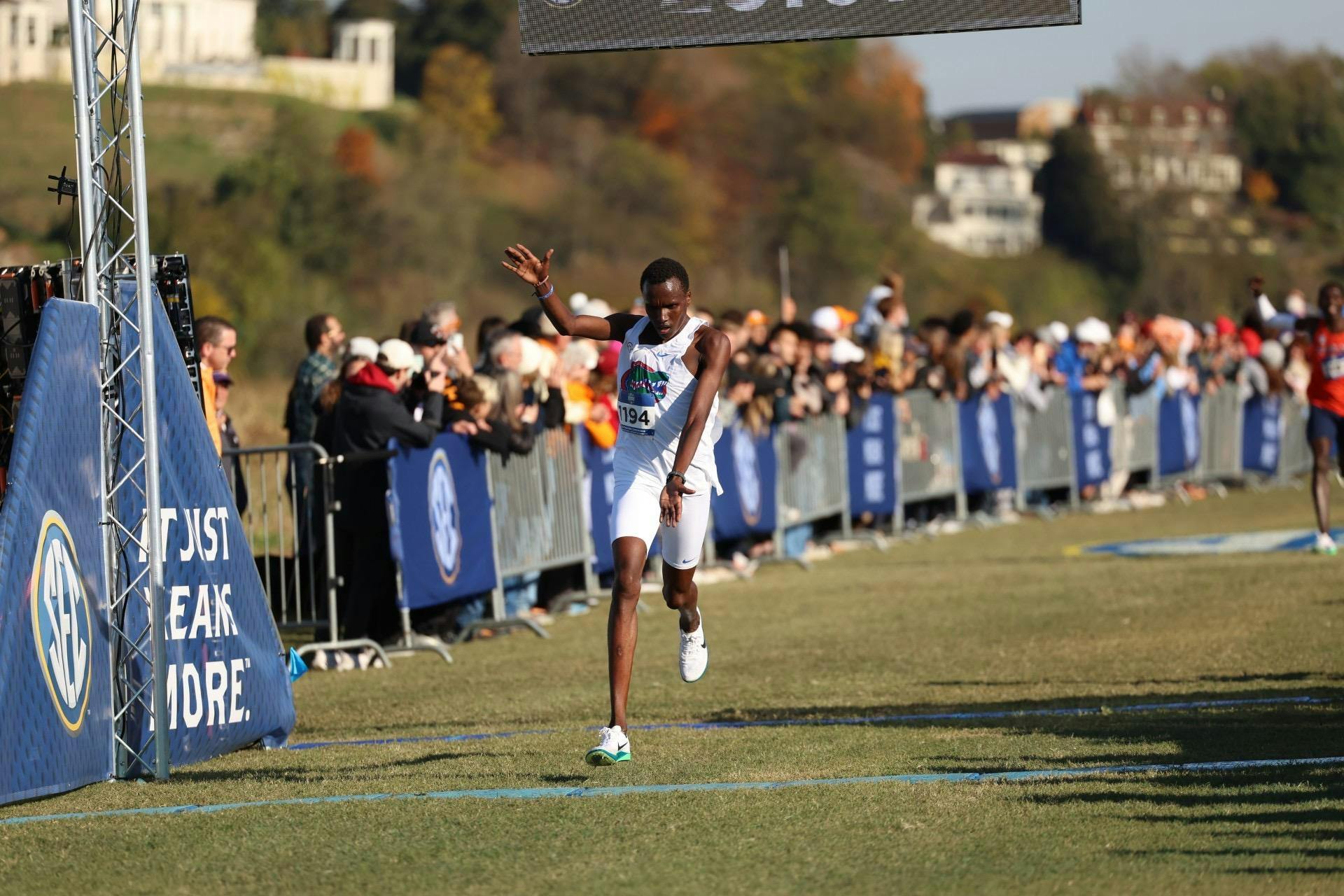 Kelvin Cheruiyot passes the finish line at the 2025 SEC Cross Country Championships.