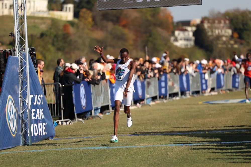 Kelvin Cheruiyot passes the finish line at the 2025 SEC Cross Country Championships.