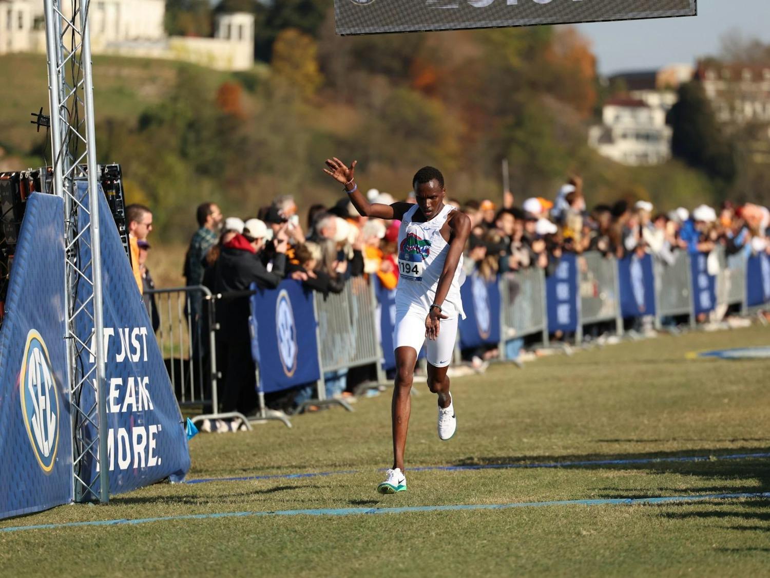 Kelvin Cheruiyot passes the finish line at the 2025 SEC Cross Country Championships.