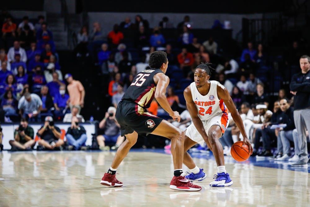<p>Florida&#x27;s Phlandrous Fleming matches up against Florida State&#x27;s Matthew Cleveland during a Nov. 14 game. Fleming scored a team-high 14 points against South Carolina Sunday.</p>