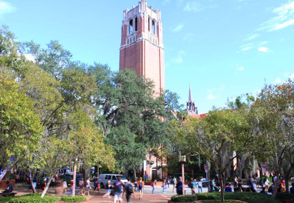 <p>Droves of students head to and from classes in front of Century Tower during class-change Thursday morning.</p>