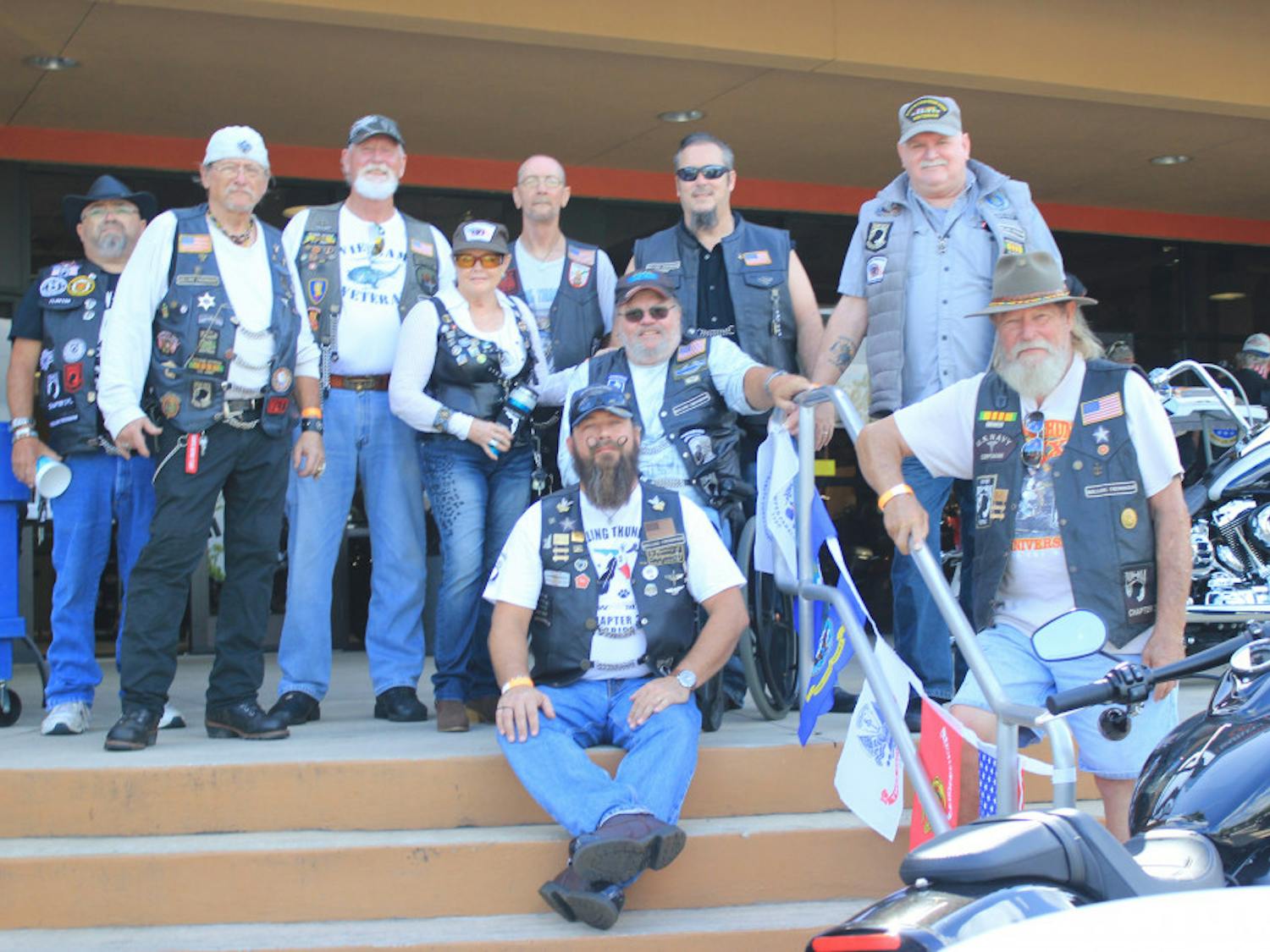 Members of Rolling Thunder pose for a group photograph outside of the Gainesville Harley-Davidson dealership.