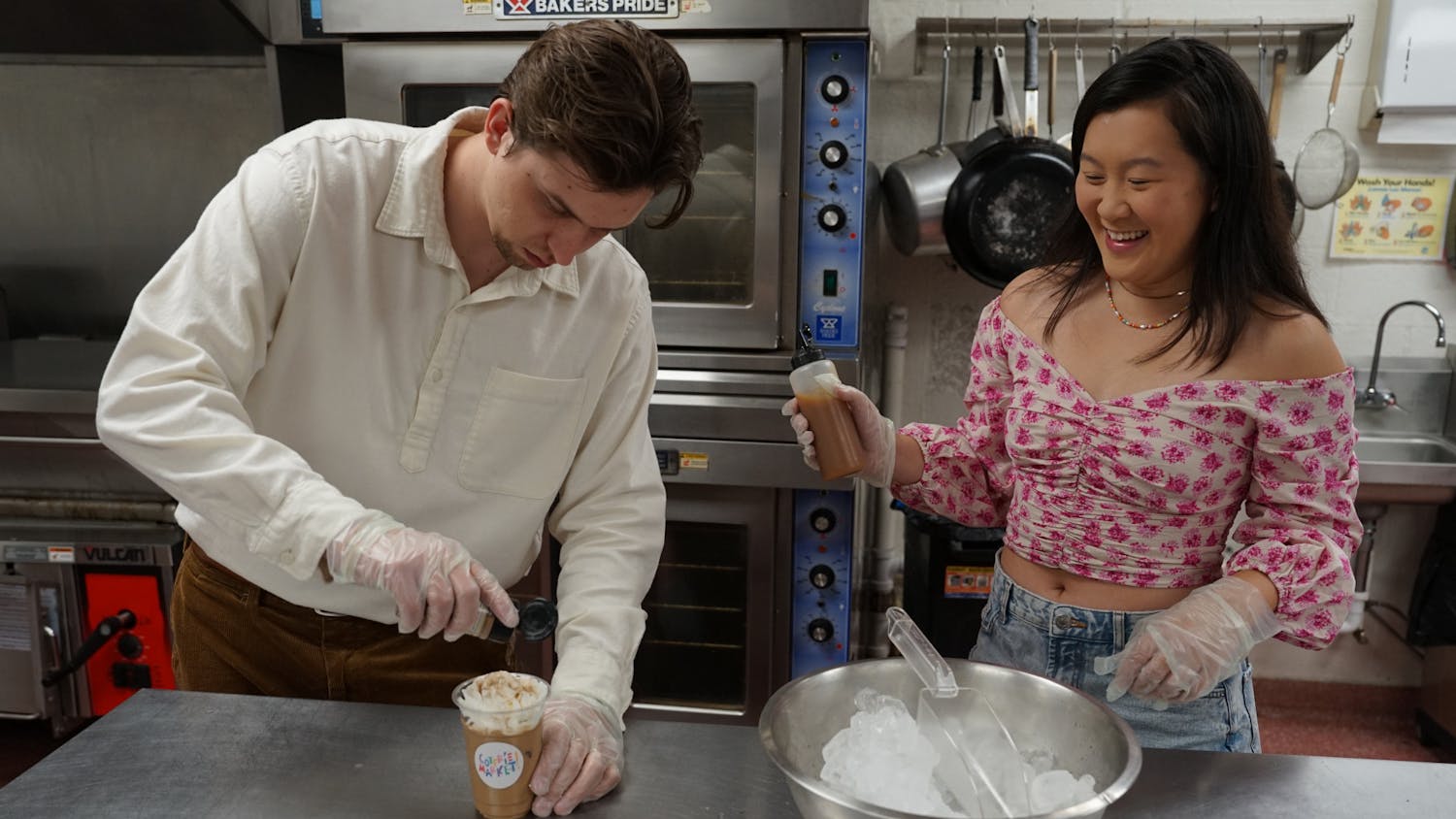 Kate Yeung and Bradon Ramirez, owners of Coterie Market, prepare their new iced superfood latte at Working Food Community Kitchen on Saturday, May 20th, 2023.