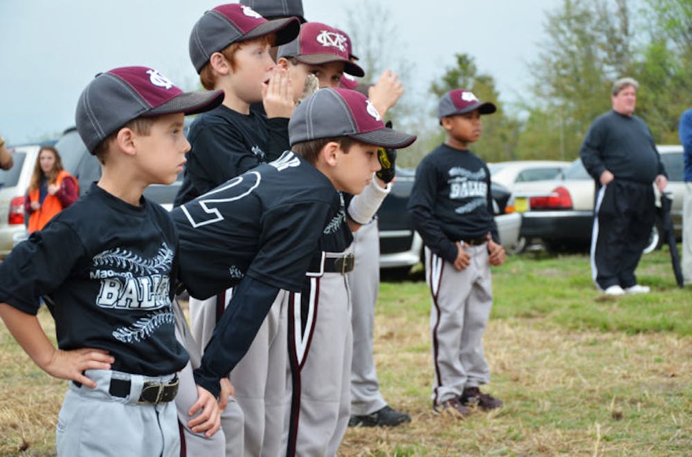 <p>Madison Ballers players watch the Nations Park Grand Opening ceremony in Newberry on Saturday. The park will host about 13 baseball tournaments this summer.</p>
