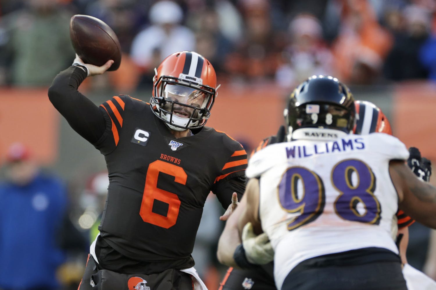 FILE - In this Sunday, Dec. 22, 2019 file photo, Cleveland Browns quarterback Baker Mayfield (6) passes against the Baltimore Ravens during the second half of an NFL football game in Cleveland. Cleveland Browns quarterback Baker Mayfield plans to kneel during the national anthem this upcoming season to support protests of social injustice, police brutality and racism, Saturday, June 13, 2020. (AP Photo/Ron Schwane, File)