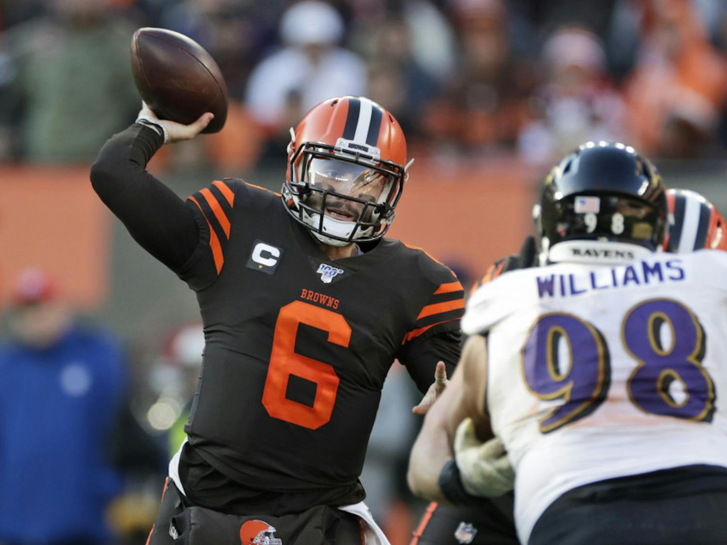 FILE - In this Sunday, Dec. 22, 2019 file photo, Cleveland Browns quarterback Baker Mayfield (6) passes against the Baltimore Ravens during the second half of an NFL football game in Cleveland. Cleveland Browns quarterback Baker Mayfield plans to kneel during the national anthem this upcoming season to support protests of social injustice, police brutality and racism, Saturday, June 13, 2020. (AP Photo/Ron Schwane, File)