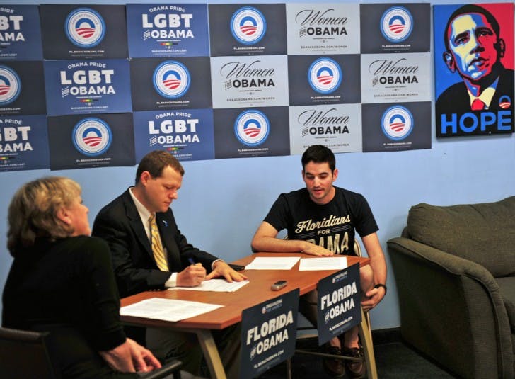 Dawn Burgess-Krop, left; Thomas Hawkins, middle; and Alex Masi discuss Mitt Romney’s “47 percent” comments Wednesday morning.