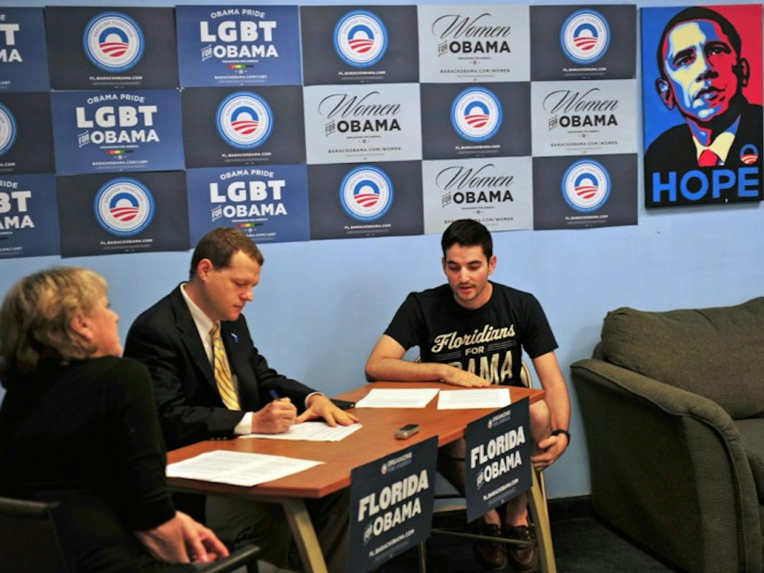 Dawn Burgess-Krop, left; Thomas Hawkins, middle; and Alex Masi discuss Mitt Romney’s “47 percent” comments Wednesday morning.