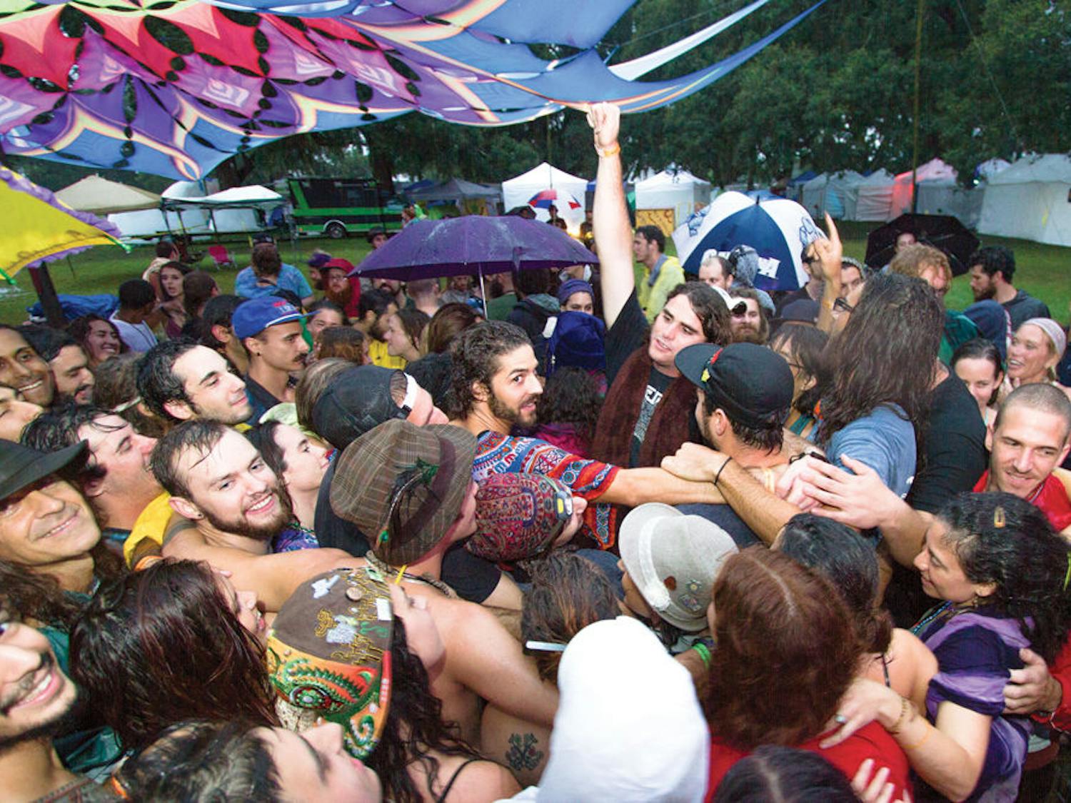 Earthdance attendees huddle for a group hug at Maddox Ranch in Lakeland, Florida on Saturday.