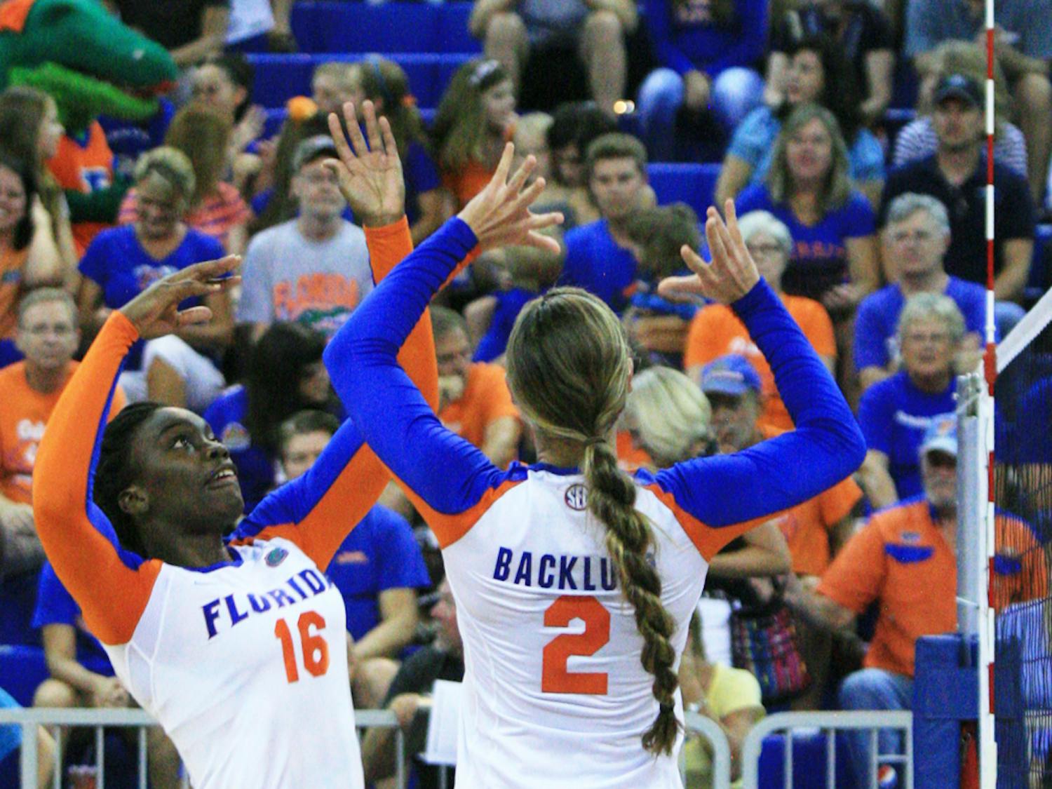 Simone Antwi (16) receives a pass from Dana Backlund (2) during UF’s 3-0 win against Jacksonville on Sept. 7, 2012, in the Stephen C. O'Connell Center. 