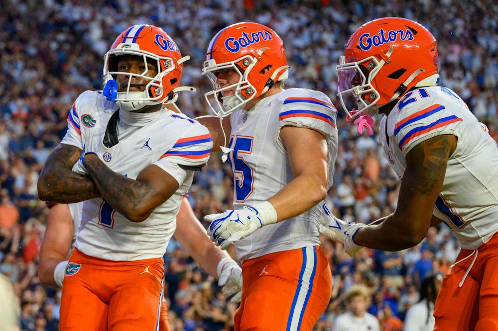 <p>Florida wide receiver Vernell Brown III (1) celebrates with tight end Luke Harping (15) and running back Evan Pryor (21) during the first half of an NCAA college football game against Auburn, Saturday, Sept. 19, 2026, in Auburn, Ala.</p>