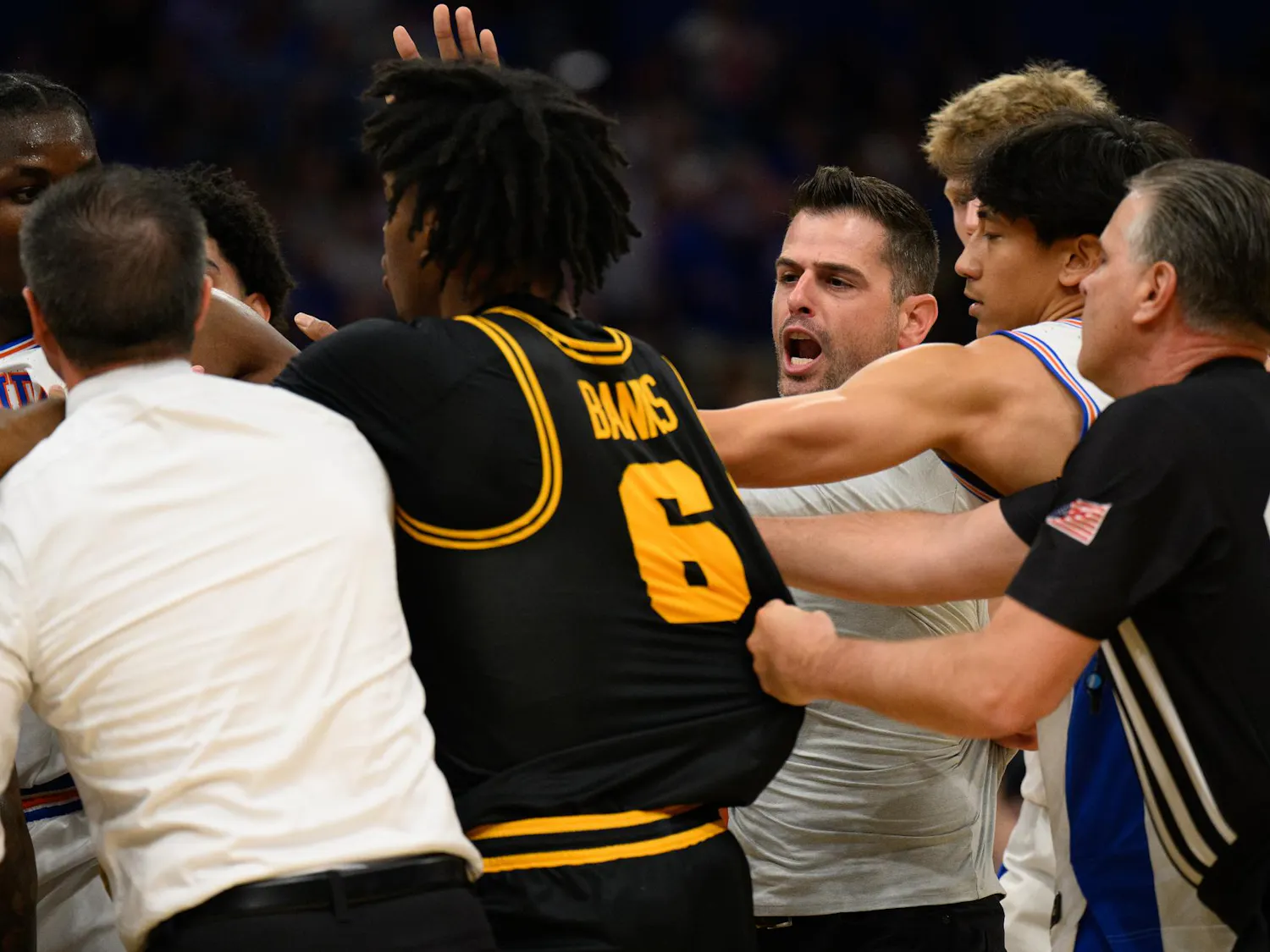 Florida head coach Todd Golden rushes a huddle during the first half of an NCAA Tournament second round game against Iowa, Sunday, March 22, 2026, in Tampa, Fla.