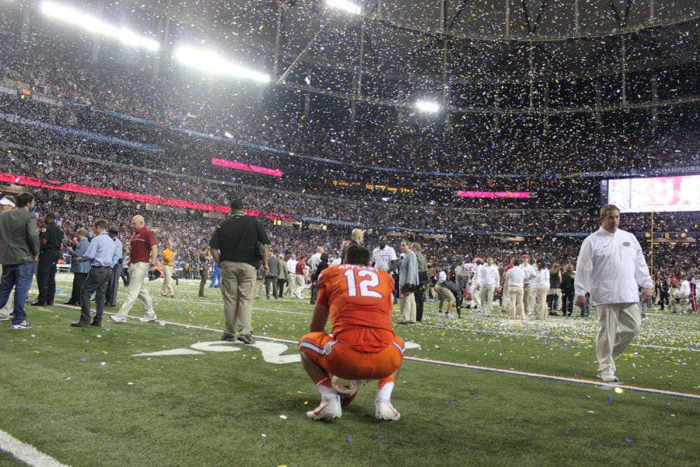 Austin Appleby kneels on the field after Florida's 54-16 loss to Alabama on Dec. 3, 2016, in the SEC Championship Game.