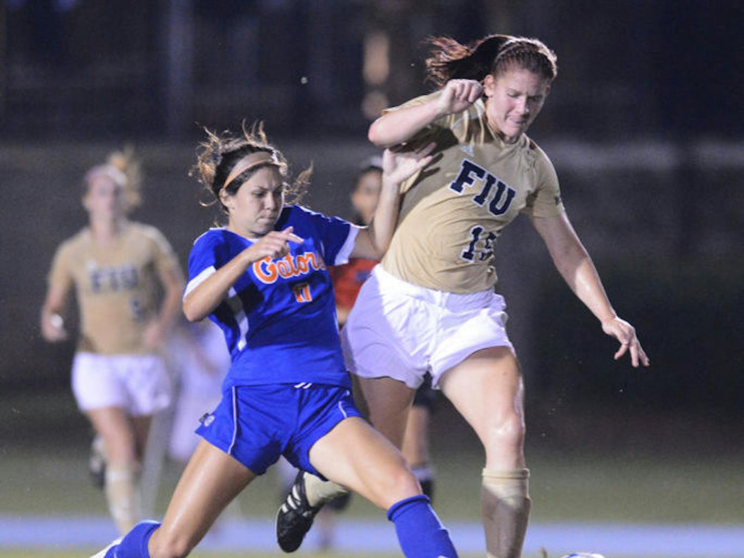 Erika Tymrak goes for the ball against a FIU defender during a match on Sept. 2, 2012. Tymrak led Florida in goals, assists and game-winning goals in her final season as a Gator.